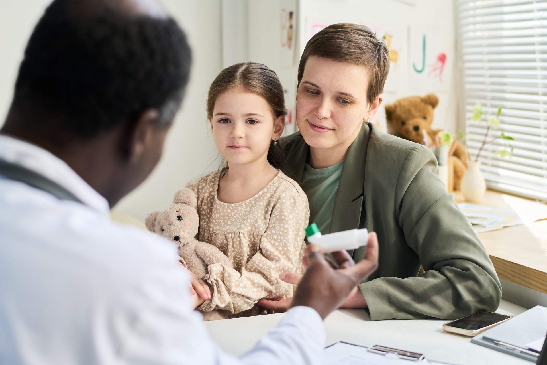 Mother and Daughter Visiting Pediatrician Office