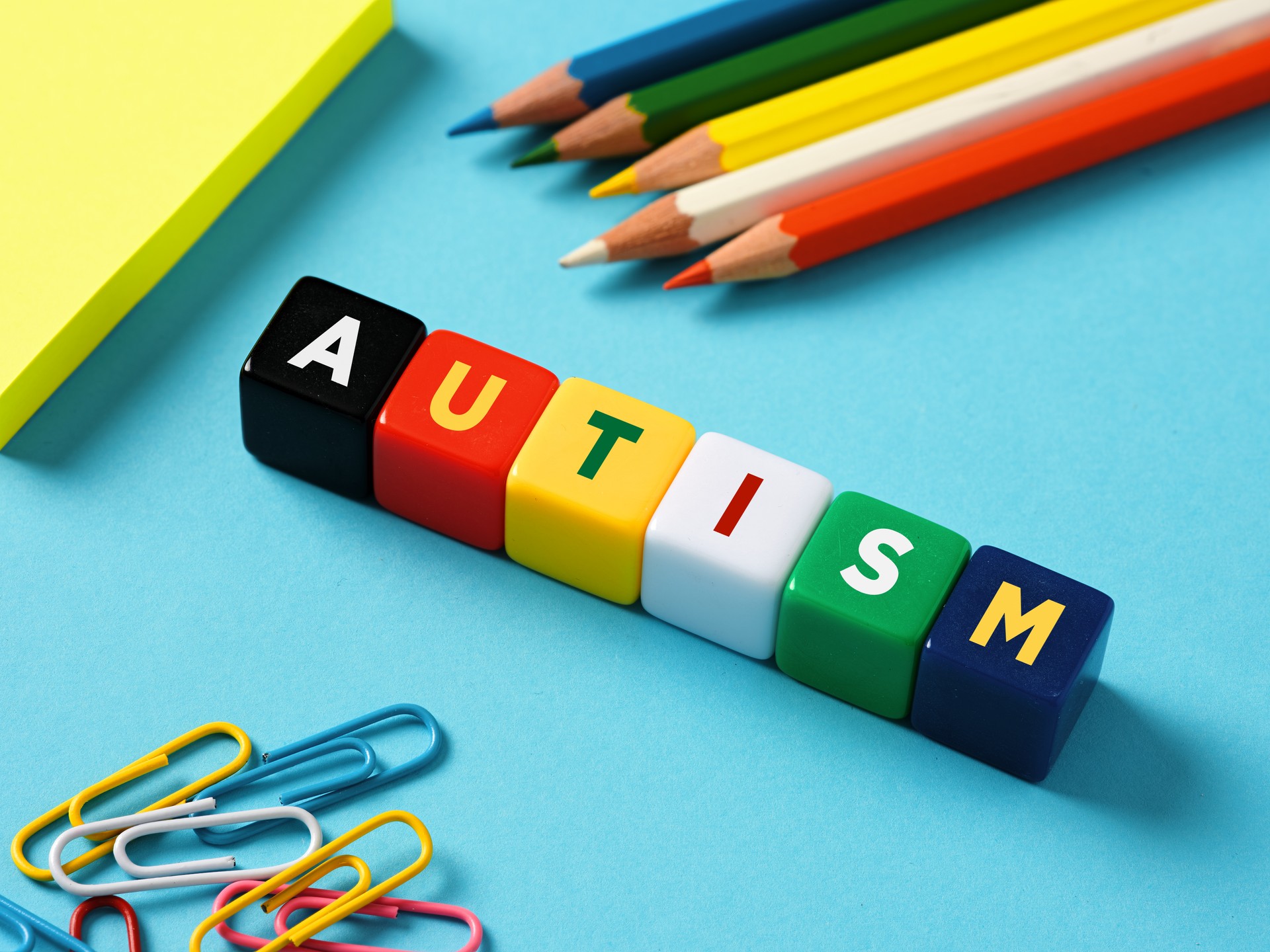 Autism and education concept. Autism spectrum disorder. The word autism on colorful cubes